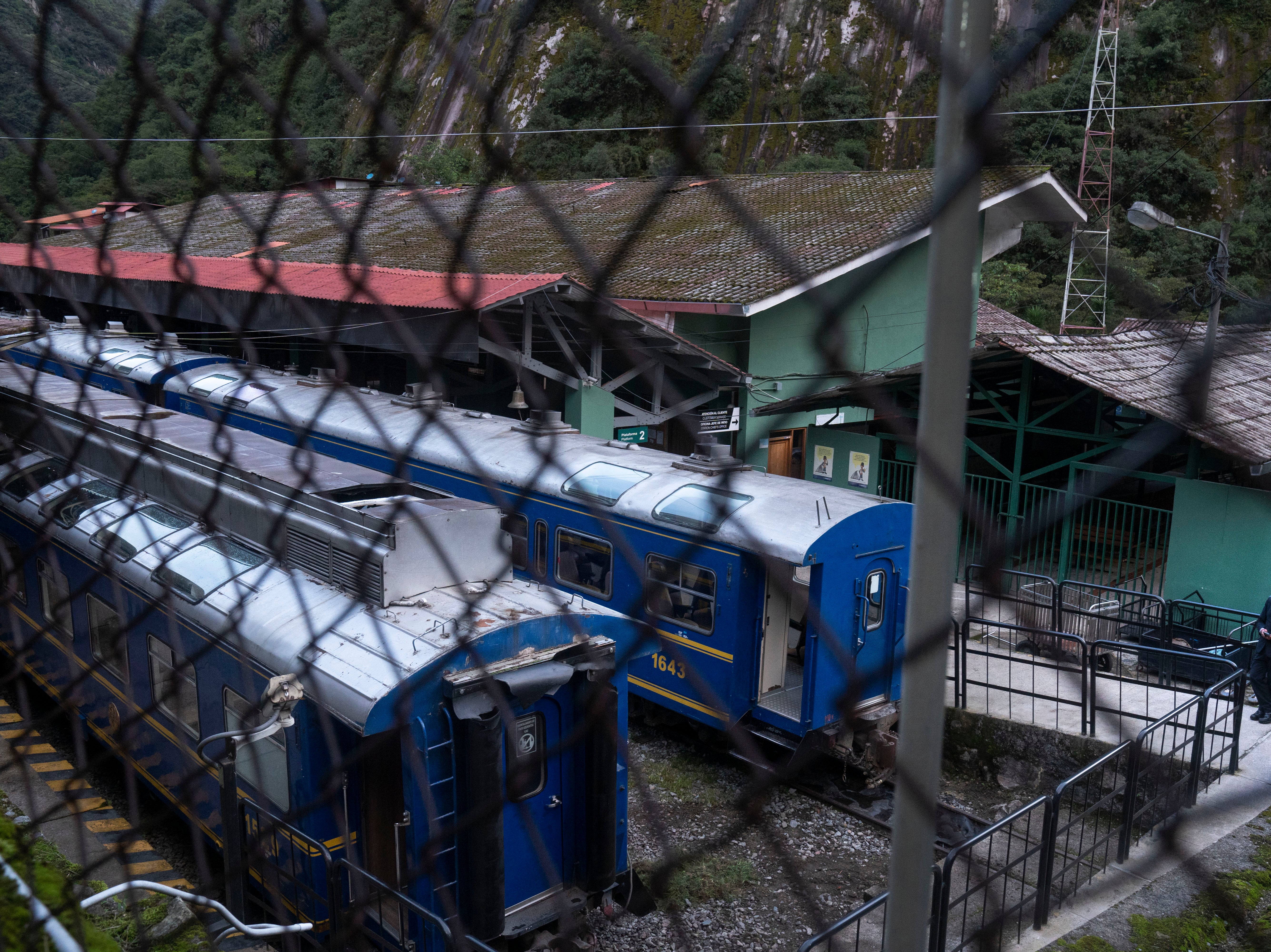 Train carriages sit idle at the railway station