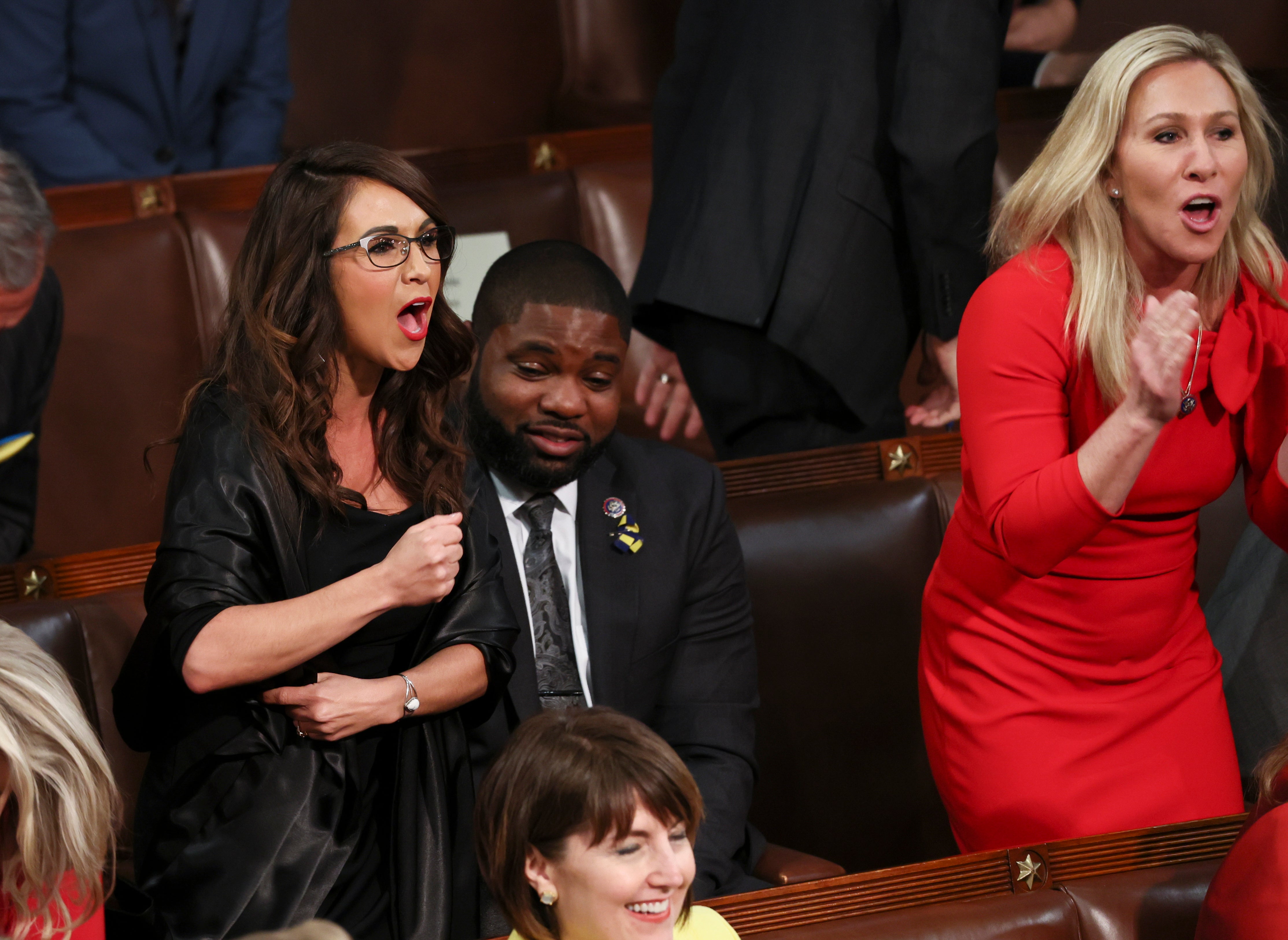 Rep. Lauren Boebert (R-CO) and Rep. Marjorie Taylor Greene (R-GA) scream "Build the Wall" as U.S. President Joe Biden delivers the State of the Union address