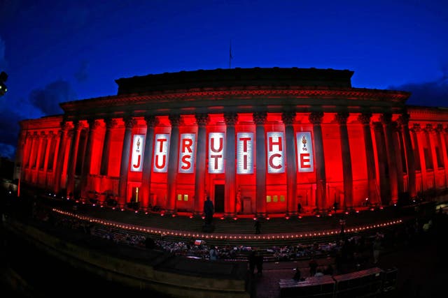 St George’s Hall in Liverpool is illuminated following a special commemorative service to mark the outcome of the Hillsborough inquest, which ruled that 96 Liverpool fans who died as a result of the Hillsborough disaster were unlawfully killed (Peter Byrne/PA)