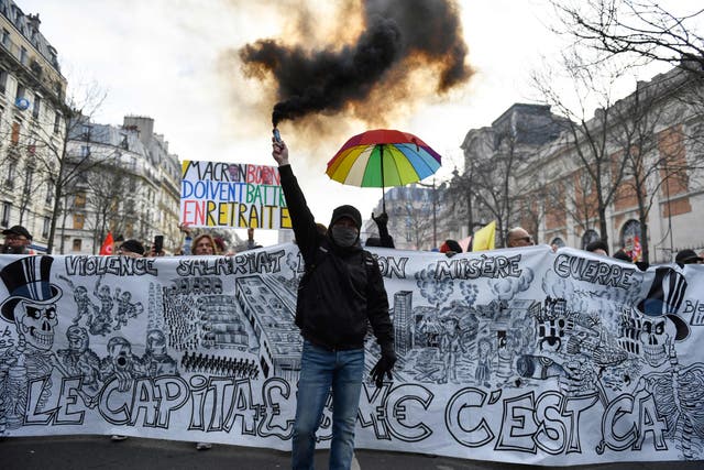 <p>A protester in Paris on Tuesday</p>