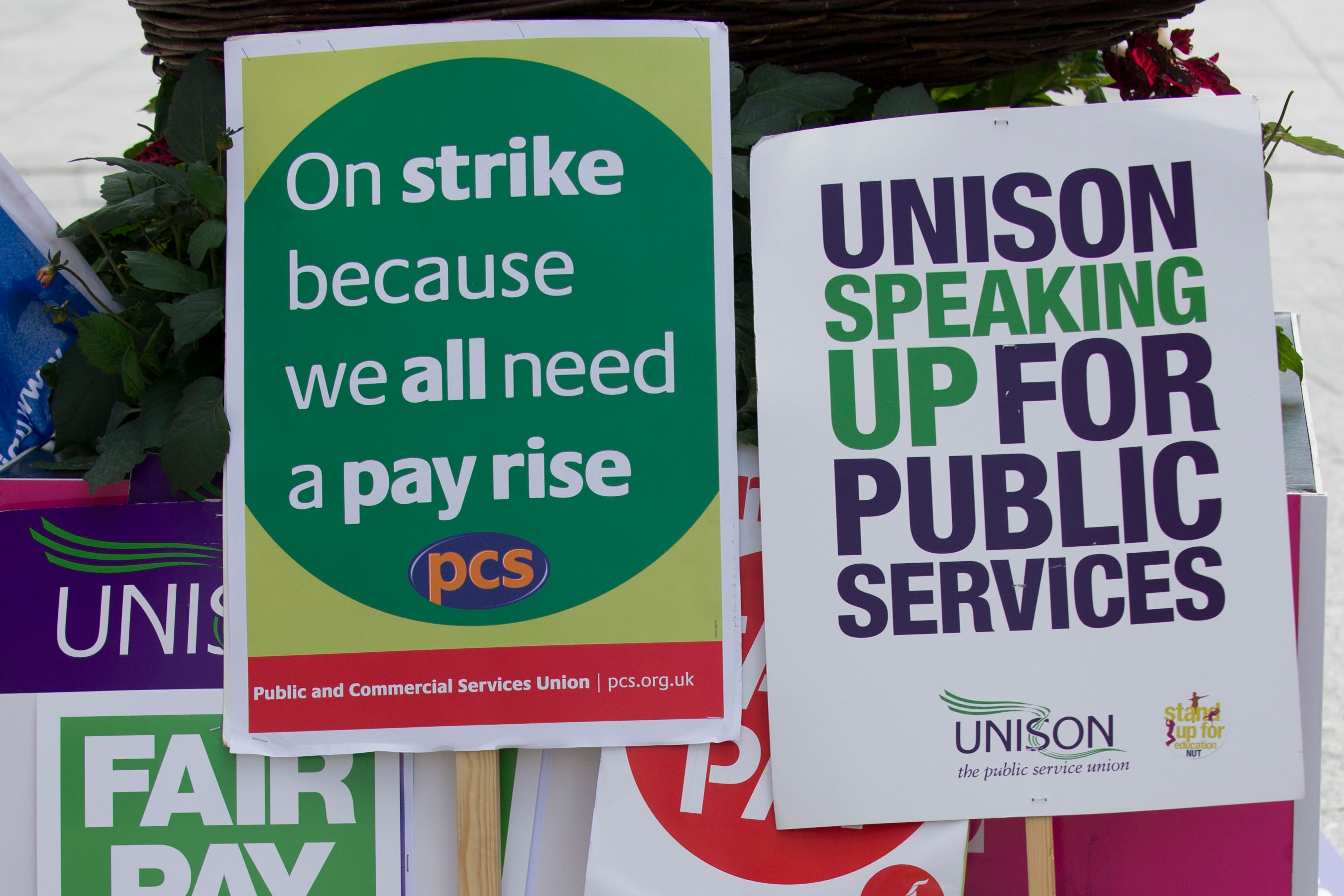 Union signs during a strike march in Nottingham city centre (Tim Goode/PA)