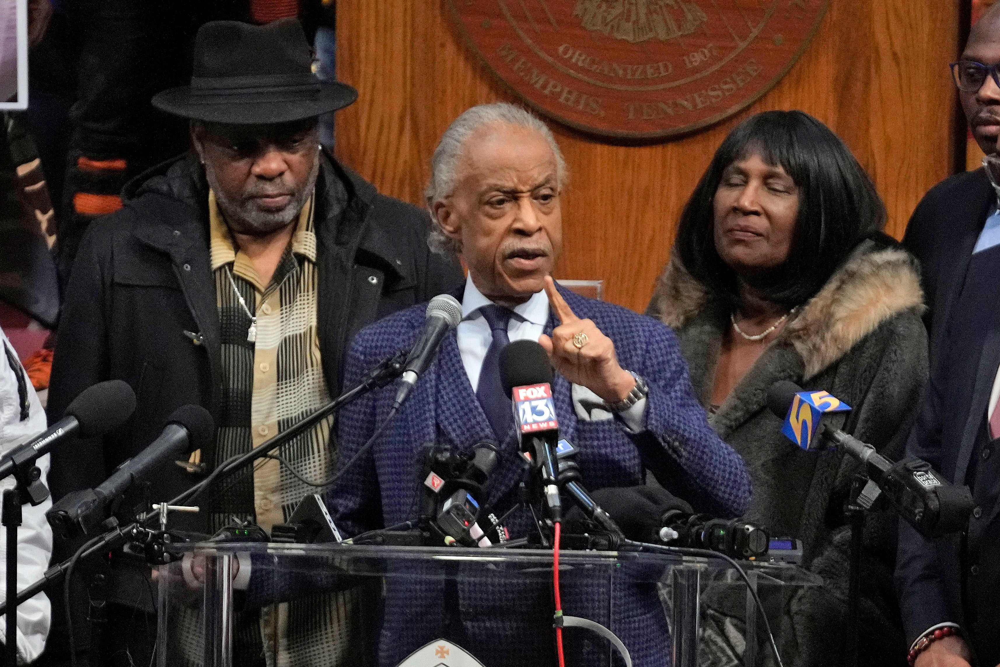 The Rev Al Sharpton speaks at the historic Mason Temple as he is flanked by RowVaughn Wells, right, mother of Tyre Nichols, and Tyre's stepfather Rodney Wells