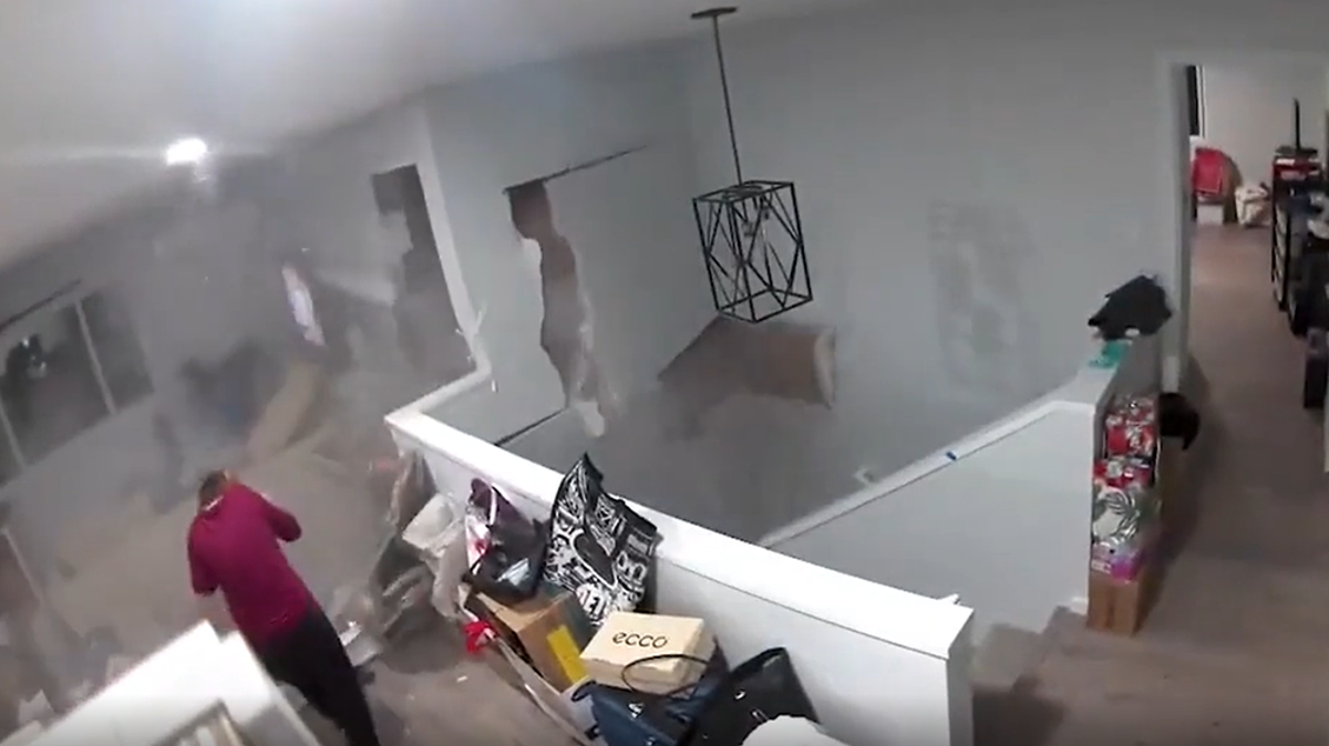 Moment 5ft boulder narrowly misses woman after crashing through Hawaii home