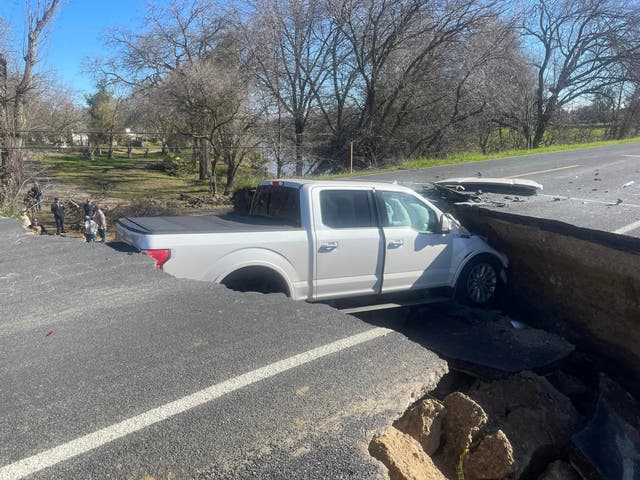 <p>A truck got stuck in a sinkhole after ignoring warning signs </p>