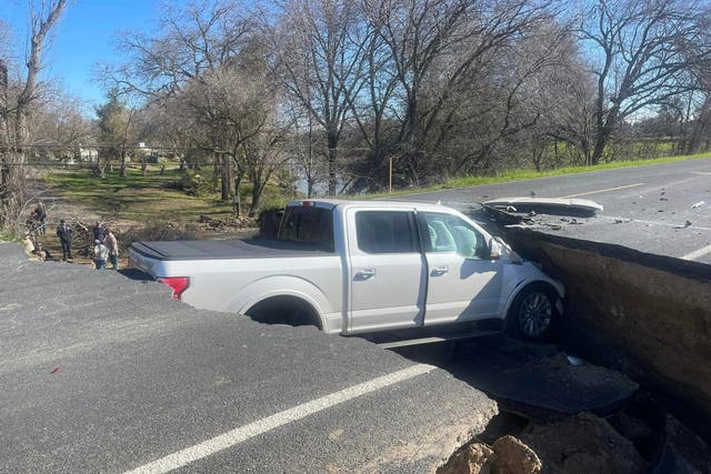 <p>A truck got stuck in a sinkhole after ignoring warning signs </p>
