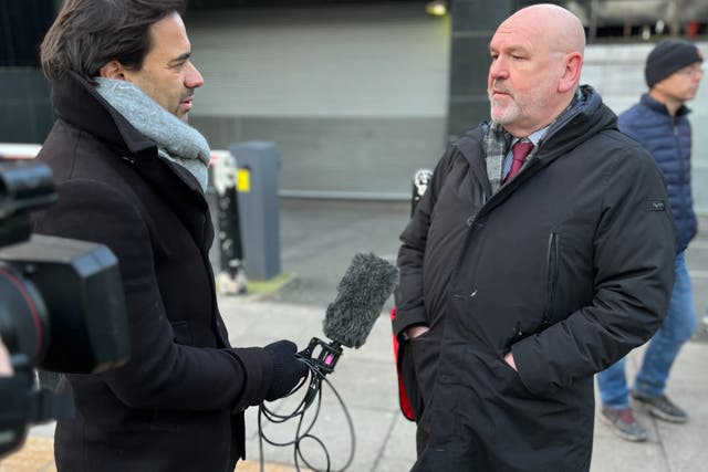 <p>All out: Mick Whelan, general secretary of the train drivers’ union, Aslef, being interviewed outside London Euston station</p>