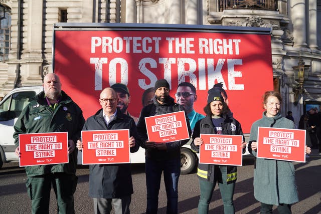 Paul Nowak, second left, joined the picket line outside Westminster Central Hall on Wednesday (PA)