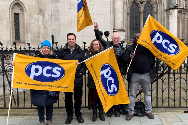 Fran Heathcote, president of the Public and Commercial Services (PCS) union (centre), with supporters who are backing a legal challenge over the Government’s handling of pension rules (Tom Pilgrim/PA)