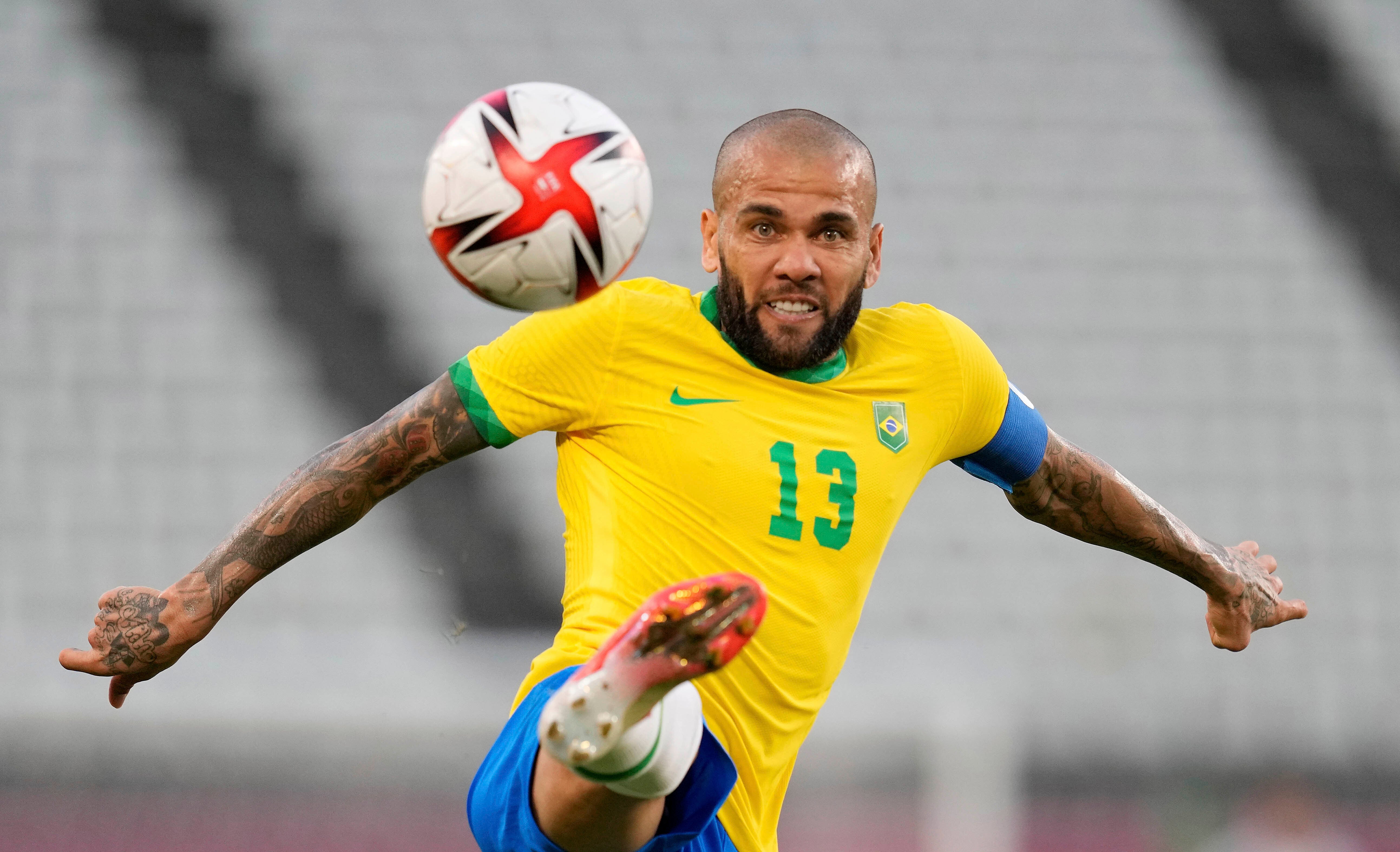 Brazil’s Dani Alves kicks the ball during a semifinal match at the 2020 Summer Olympics