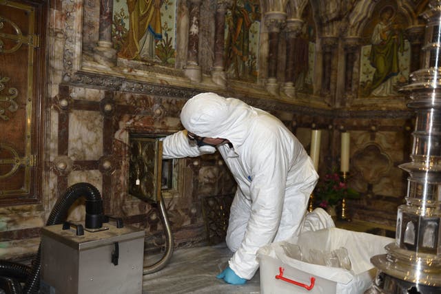 Archaeologist removing St Eanswythe’s remains at Church of St Mary and St Eanswythe in Folkestone in 2020 (Mark Hourahane/PA)