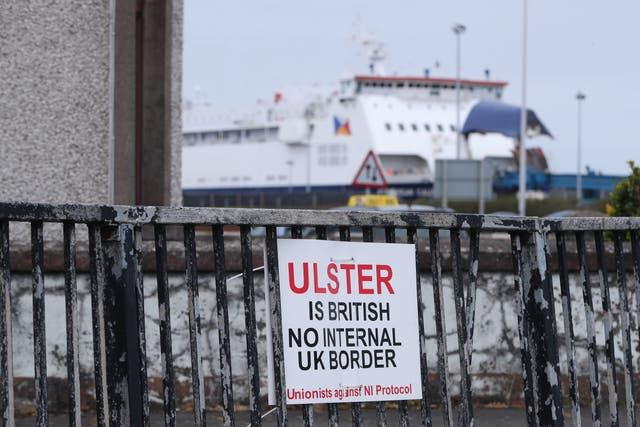A sign protesting against the Northern Ireland Protocol in Larne Harbour, Northern Ireland (Niall Carson/PA)