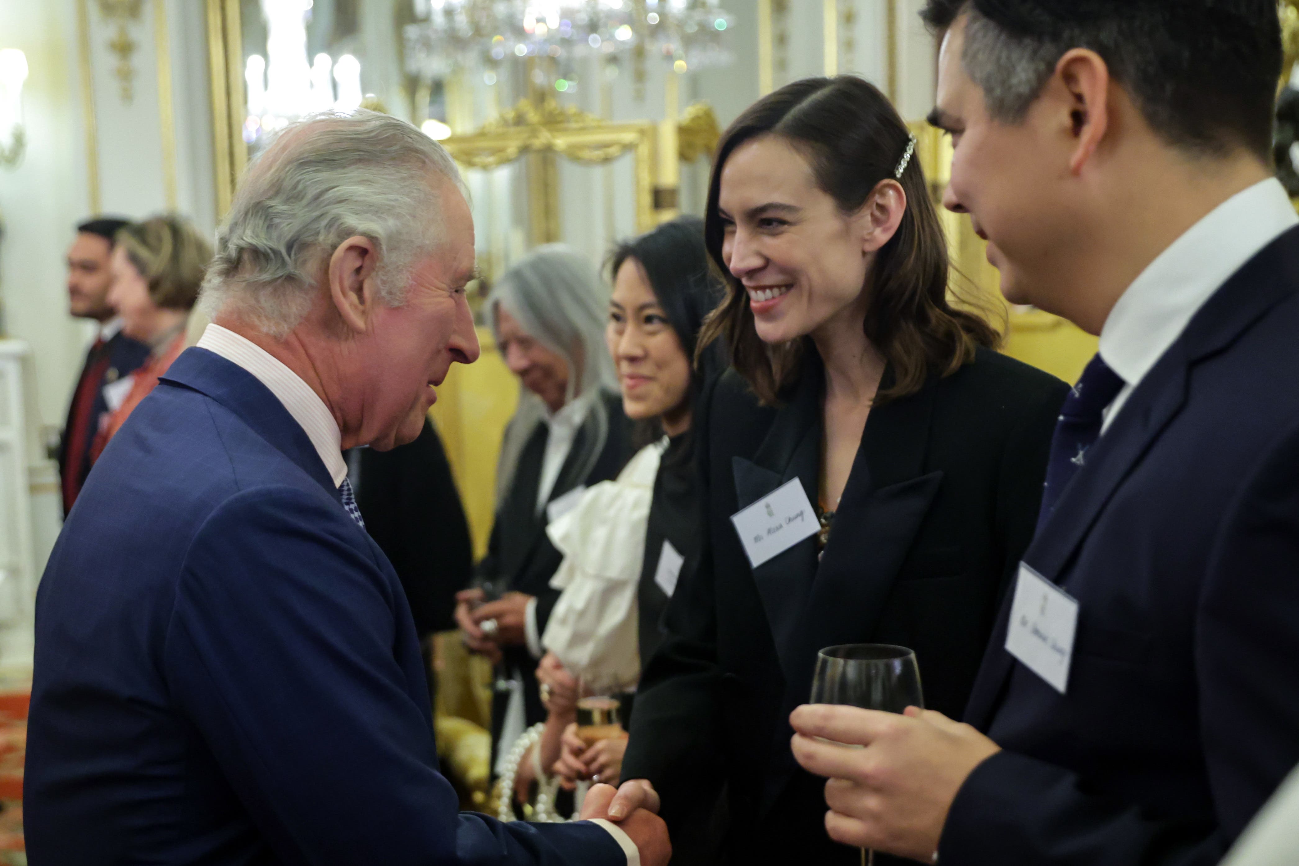 The King spoke with fashion designer Alexa Chung at a reception to celebrate British East and South-East Asian communities