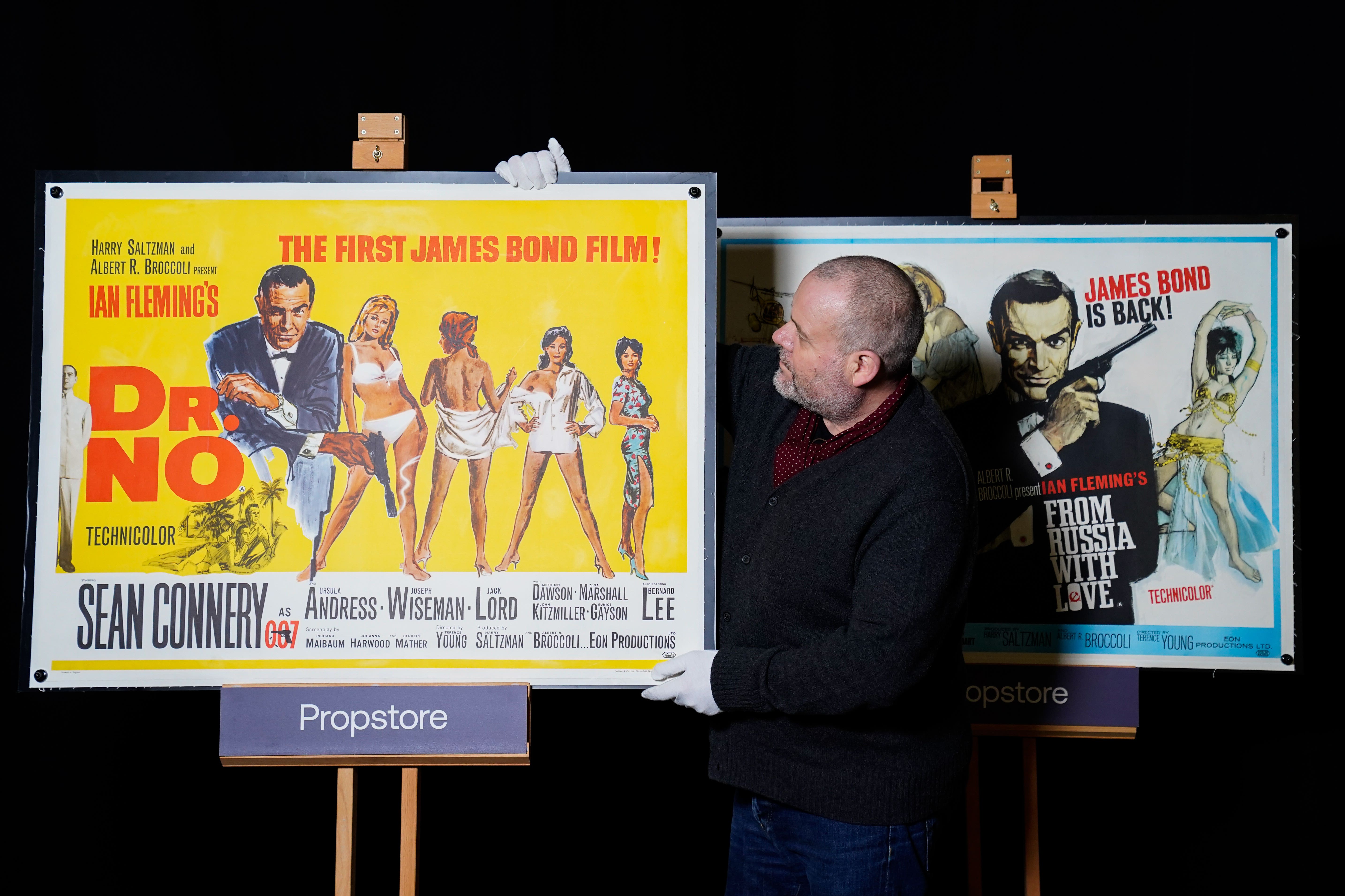 Original posters for James Bond and Star Wars films are going up for auction along with a selection of other similar lots (Andrew Matthews/PA)