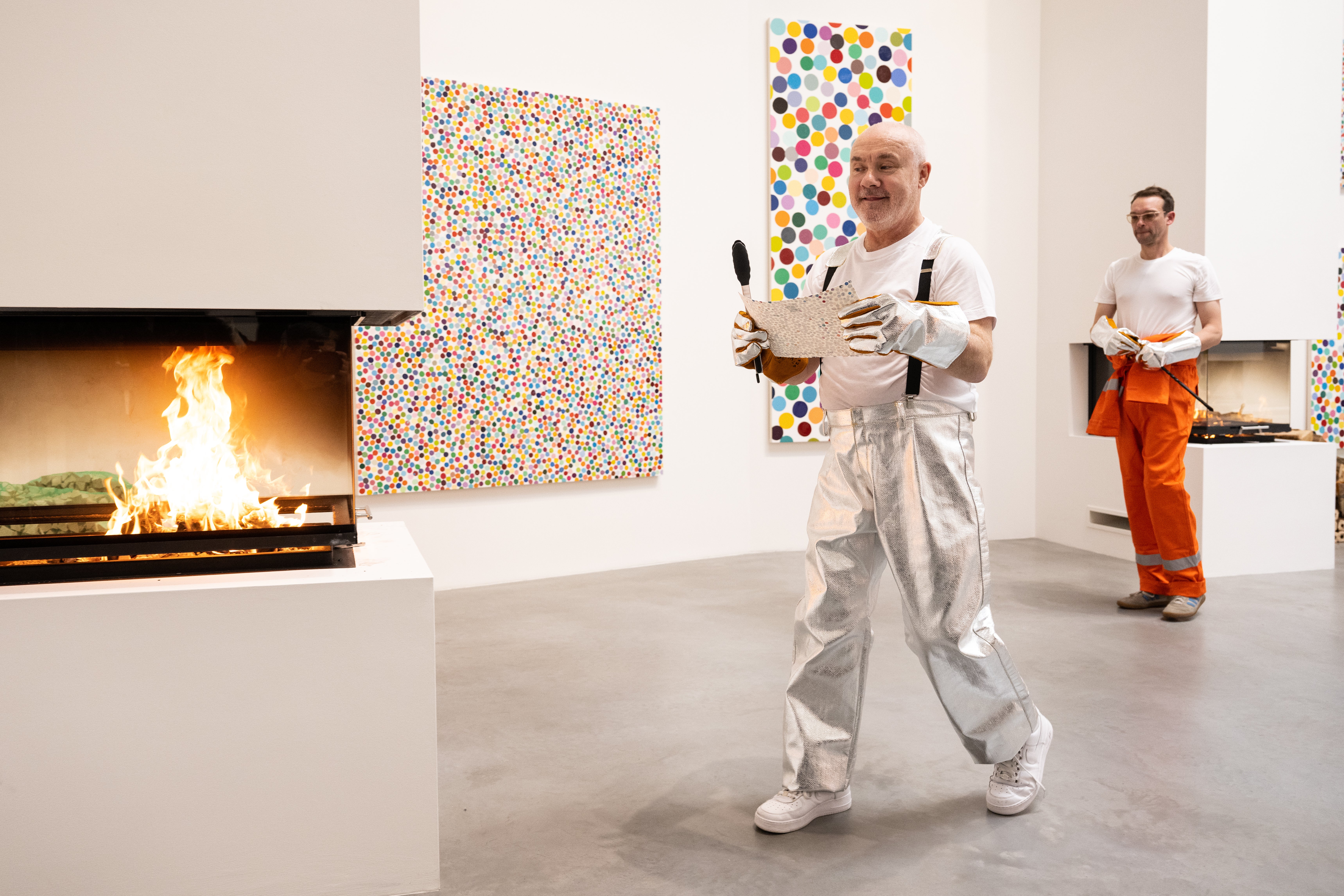 Damien Hirst takes part in the burning of artworks at Newport Street Gallery in October