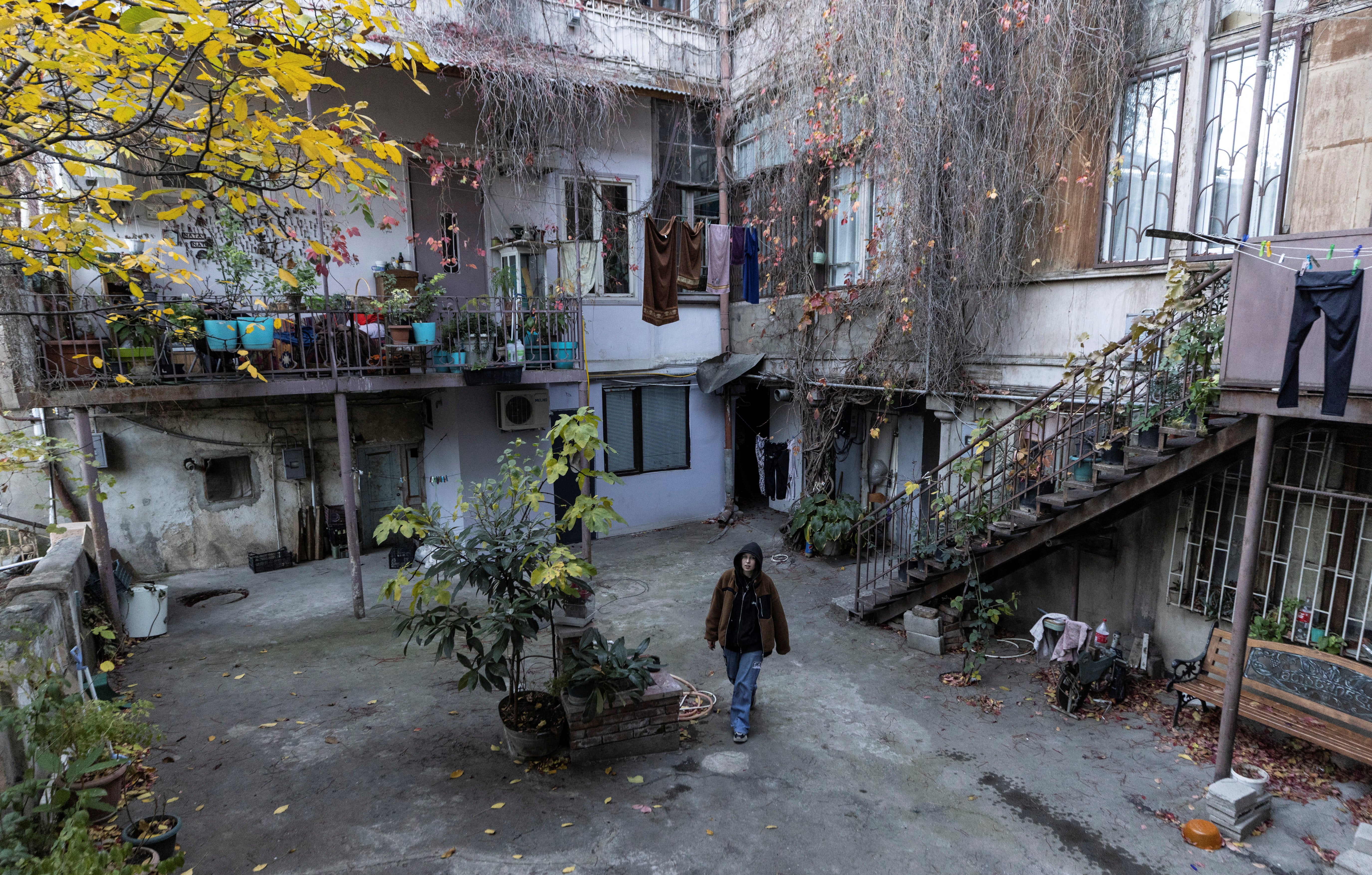 Anastasia Ivanova, 22, a Russian singer also known as Grechka, walks in the centre of Tbilisi