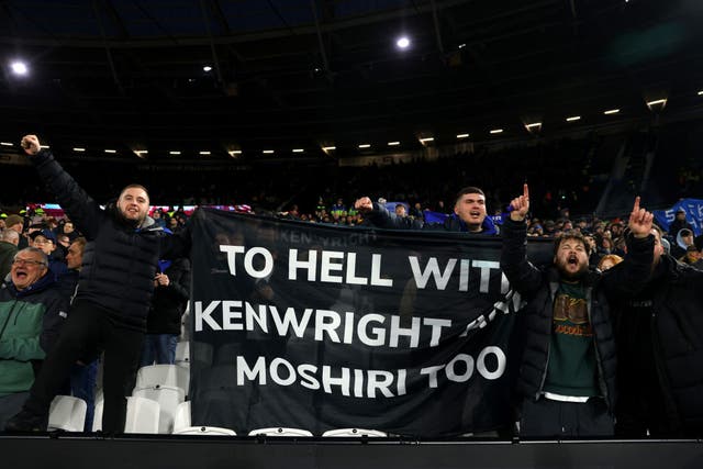 <p>Everton fans hold a banner aimed at the club’s owners as discontent mounts</p>