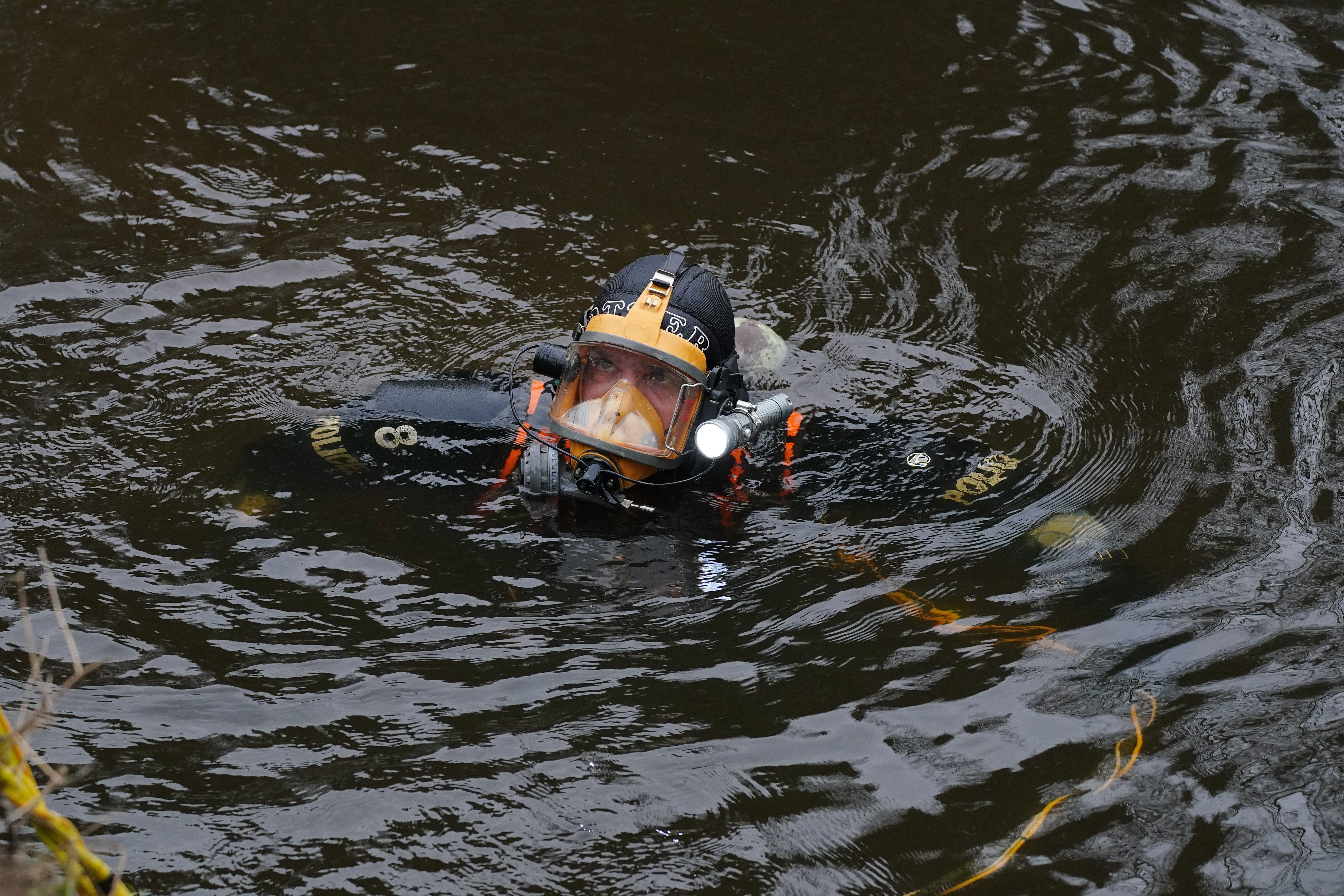 A diver searches in the River Wyre, in St Michael’s on Wyre, Lancashire