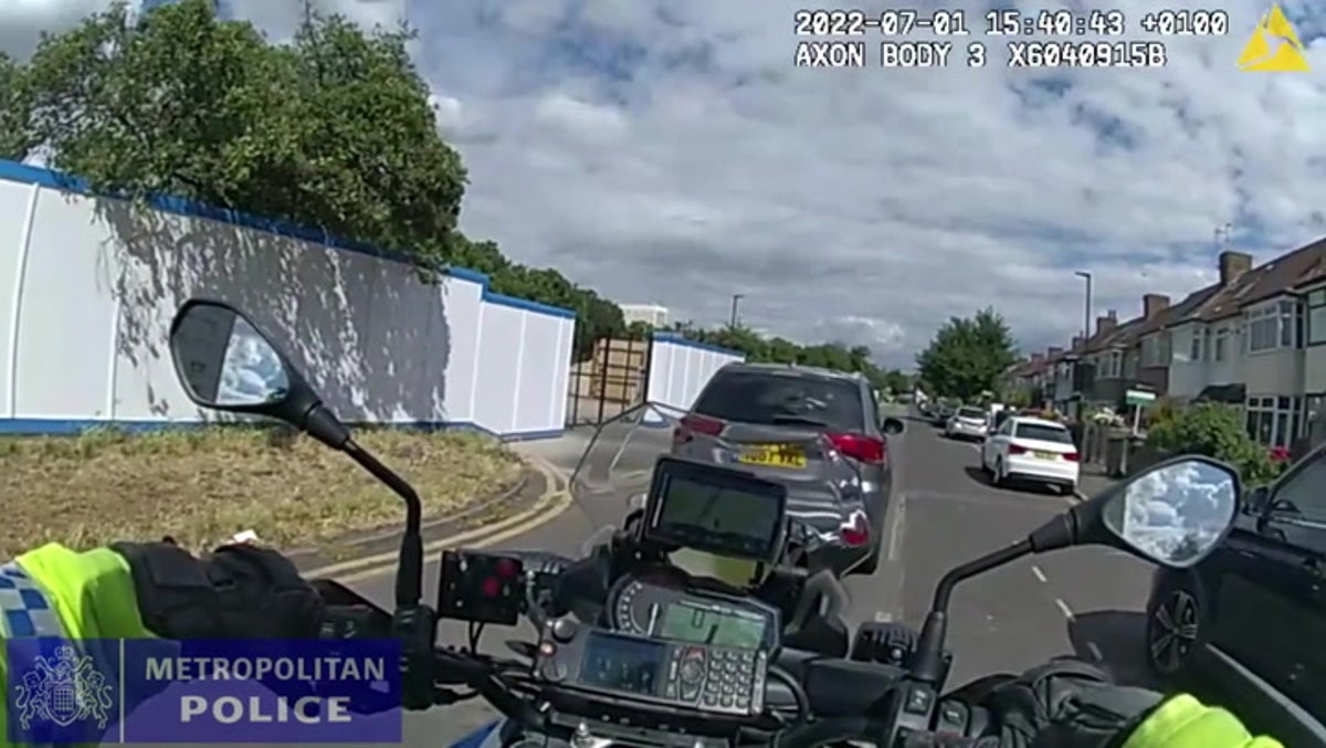 Moment disqualified driver rams police motorbike with car