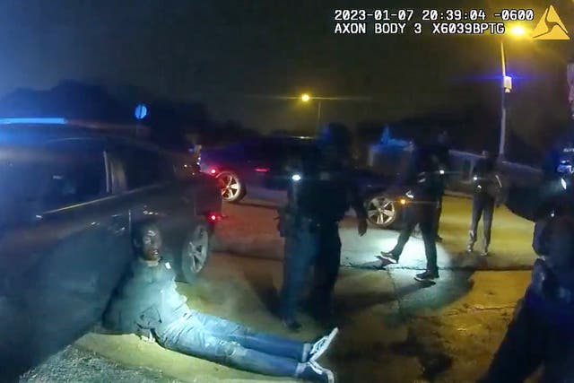 <p>In footage released by Memphis PD, Tyre Nichols lies slumped on the ground after being attacked by five police officers </p>