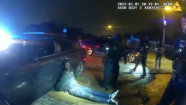<p>In footage released by Memphis PD, Tyre Nichols lies slumped on the ground after being attacked by five police officers </p>