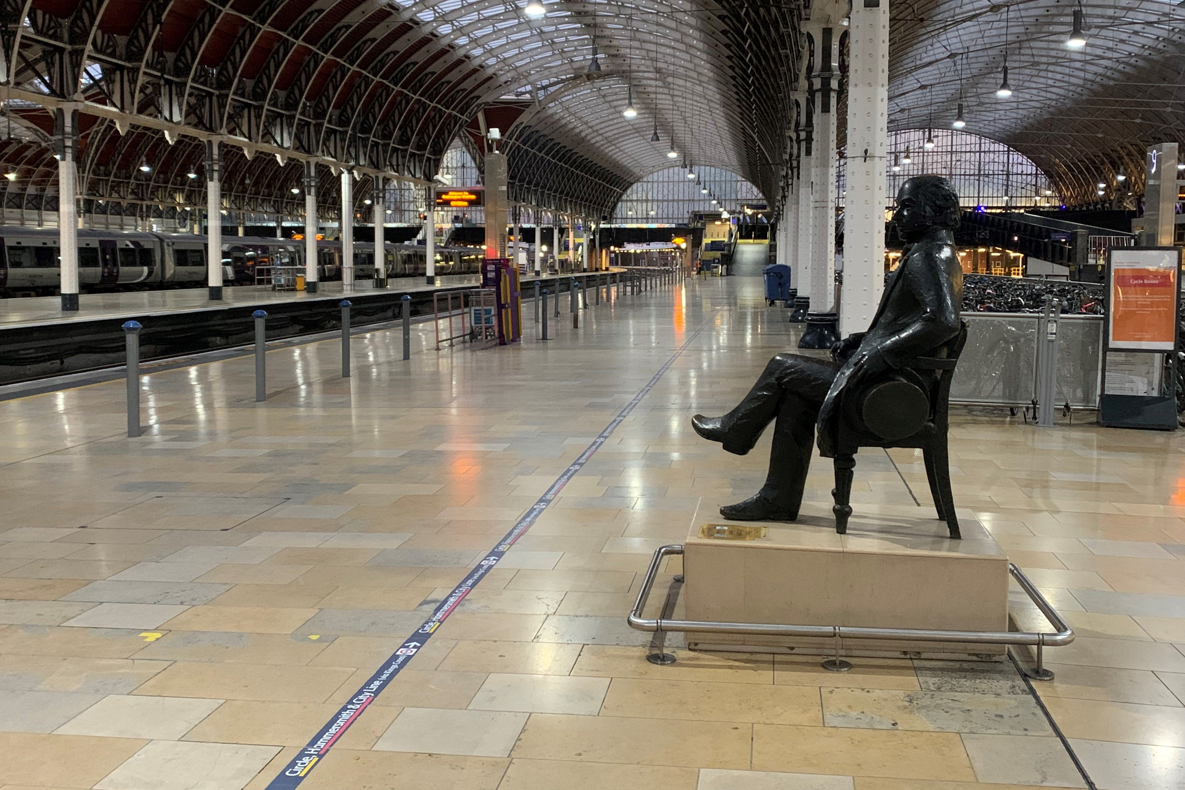A statue of Isambard Kingdom Brunel sits on an empty platform at Paddington (Peter Clifton/PA)