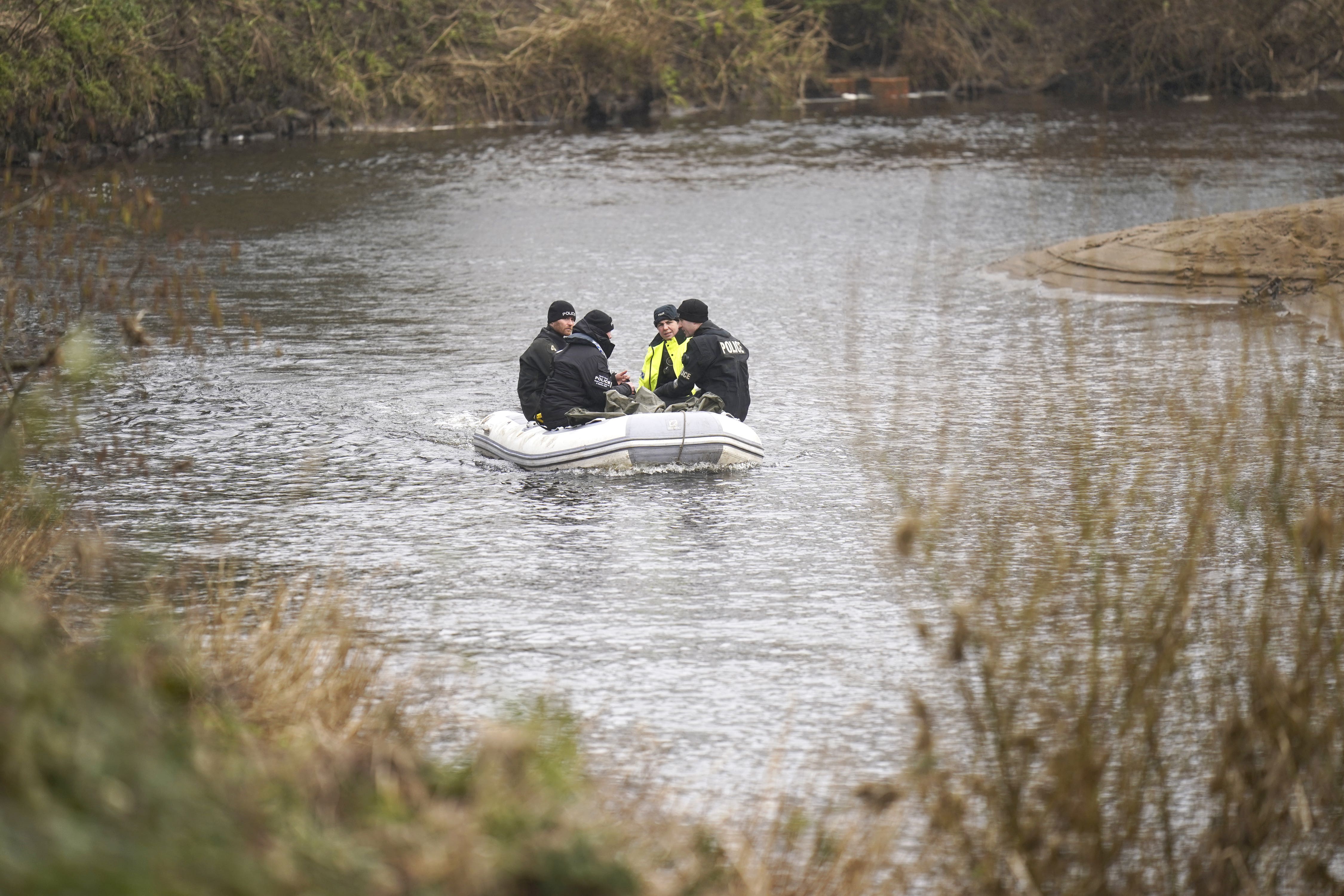 Police officers on the River Wyre (PA)