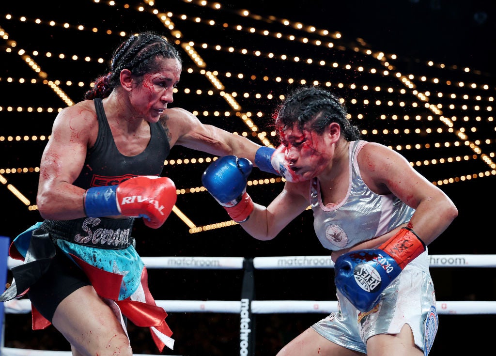 Amanda Serrano punches Erika Cruz during their title fight at the Theater at Madison Square Garden, New York