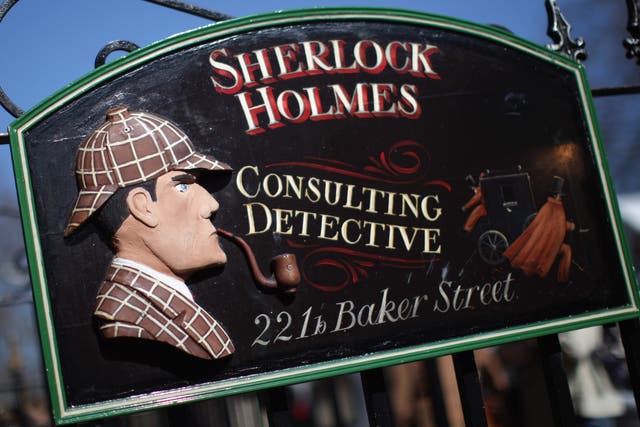 <p>A sign outside the former home of fictional character Sherlock Holmes</p>