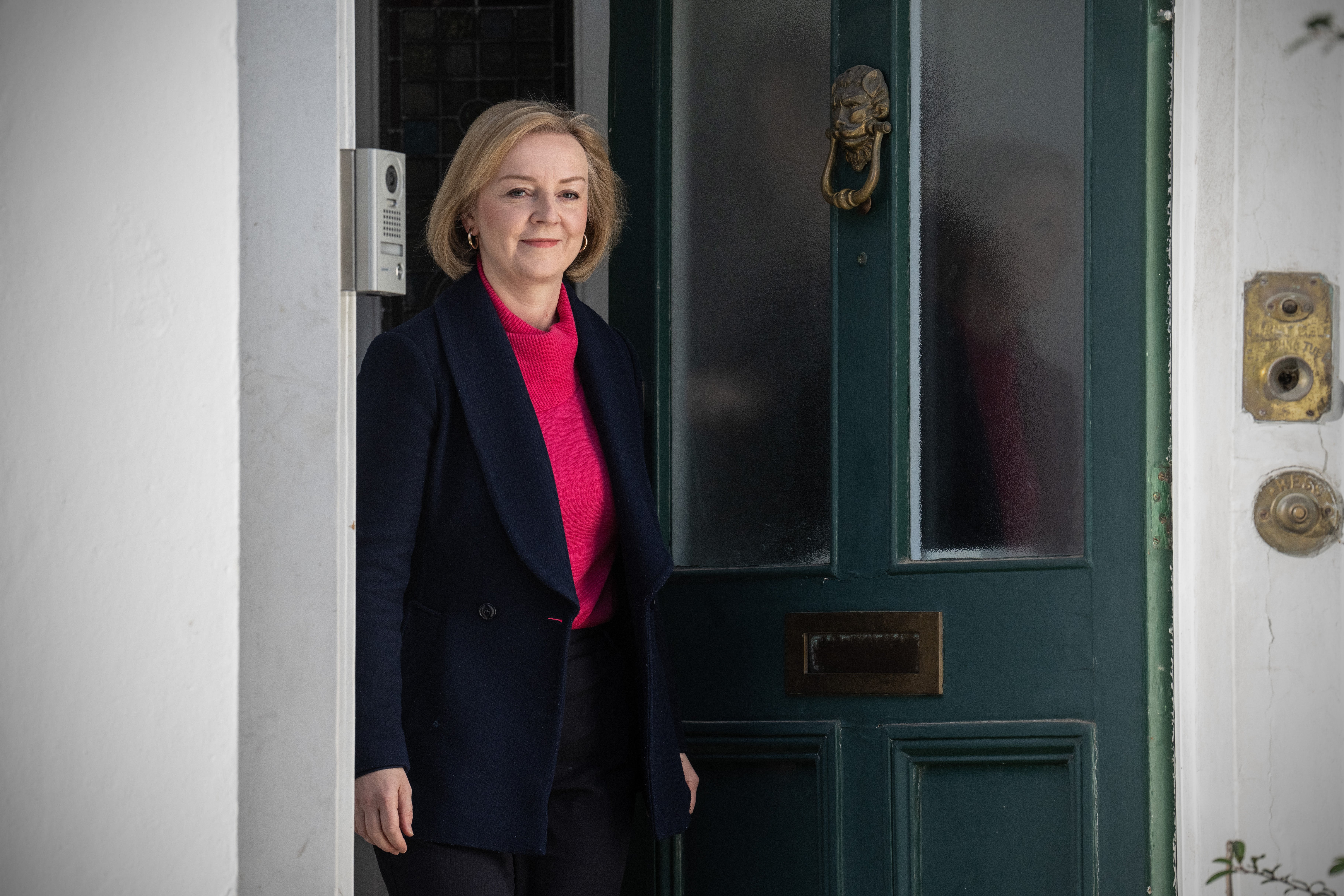 Back in the public eye: Truss leaves her house on Sunday