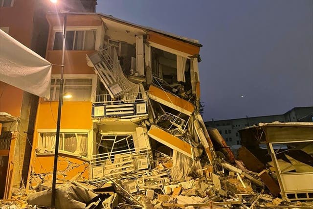<p>A collapsed building is seen following an earthquake in Pazarcik, in Kahramanmaras province, southern Turkey</p>