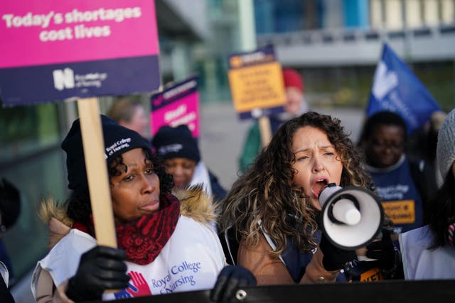 Workers on the picket line outside Queen Elizabeth Hospital Birmingham (Jacob King/PA)