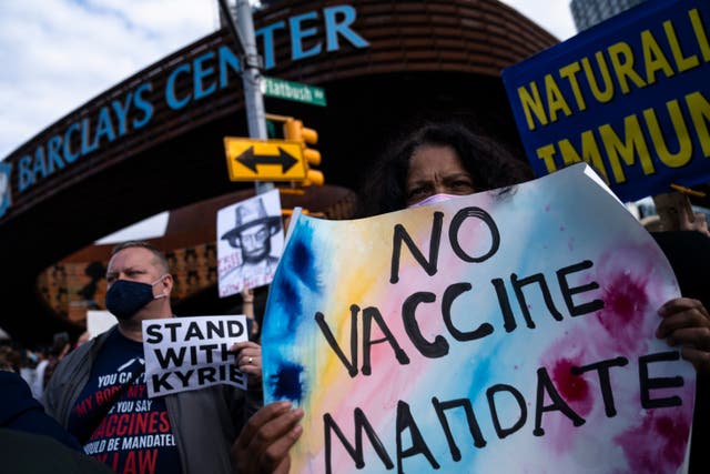 <p>Protesters rallying against COVID-19 vaccination mandates gather in the street outside the Barclays Center before an NBA basketball game between the Brooklyn Nets and the Charlotte Hornets, Sunday, Oct. 24, 2021, in New York</p>