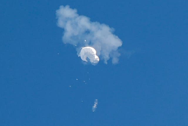 <p>The suspected Chinese spy balloon drifts to the ocean after being shot down off the coast in Surfside Beach, South Carolina on 4 February</p>