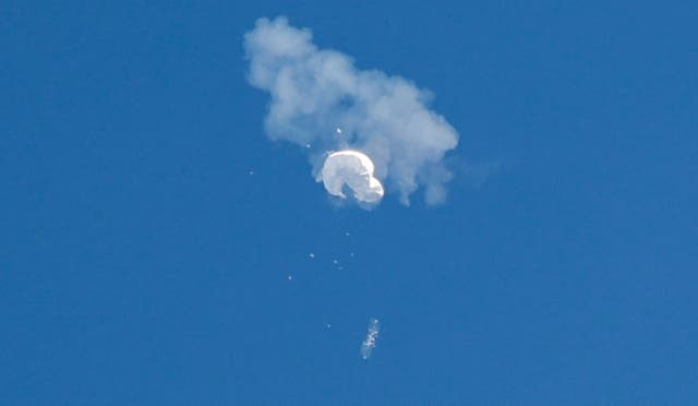 <p>The suspected Chinese spy balloon drifts to the ocean after being shot down off the coast in Surfside Beach, South Carolina on 4 February</p>