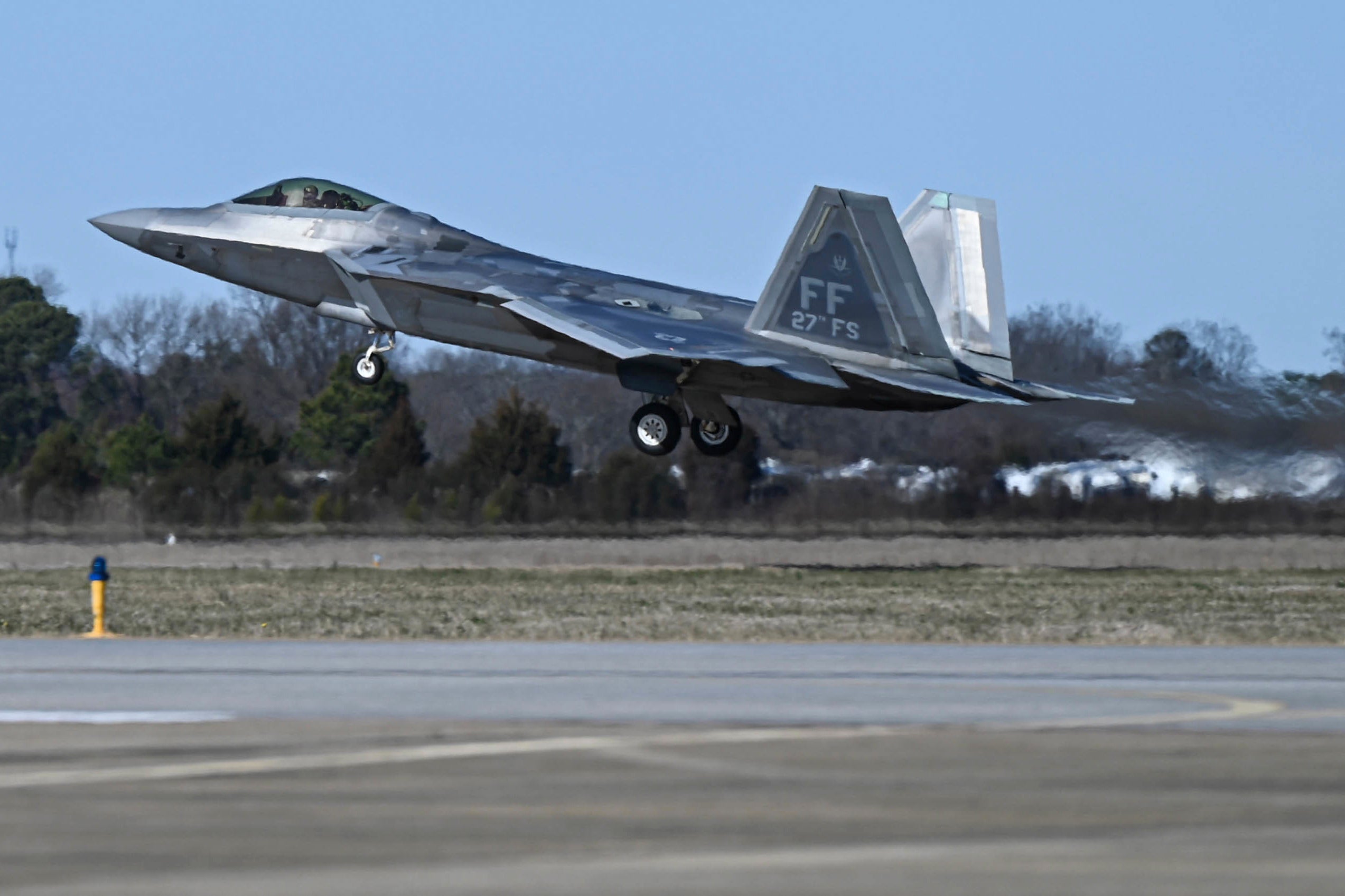This photo provided by the U.S. Air Force shows a U.S. Air Force pilot taking off in an F-22 Raptor at Joint Base Langley-Eustis on 4 February