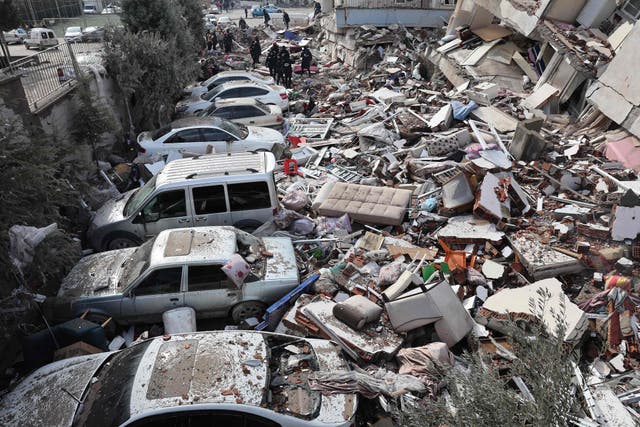 <p>Vehicles are crushed under the rubble of collapsed buildings in Kahramanmaras</p>