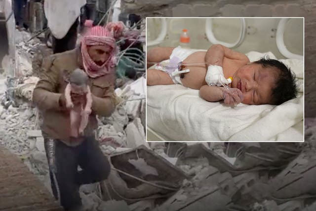 <p>The baby is pulled from the rubble and given treatment </p>