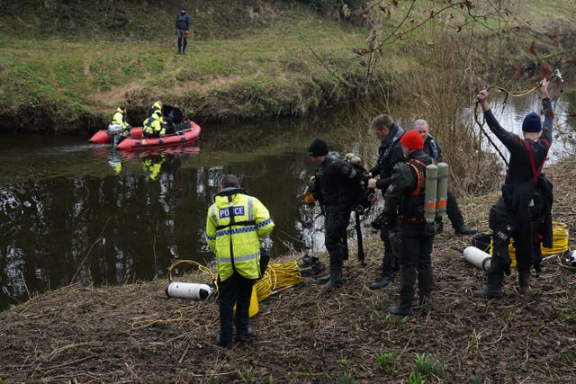 <p>Police search teams at the River Wyre in St Michael’s on Wyre, Lancashire (Peter Byrne/PA)</p>