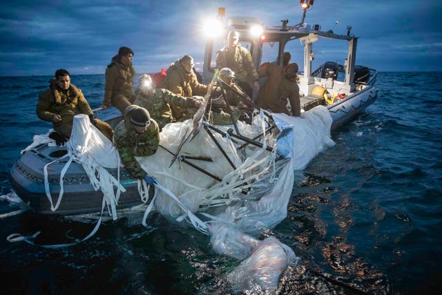 <p>An image released by the US Navy shows sailors with the Explosive Ordnance Disposal Group recover what the Pentagon has described as a “high-altitude surveillance balloon” off the coast of Myrtle Beach, South Carolina, Feb. 5, 2023.</p>