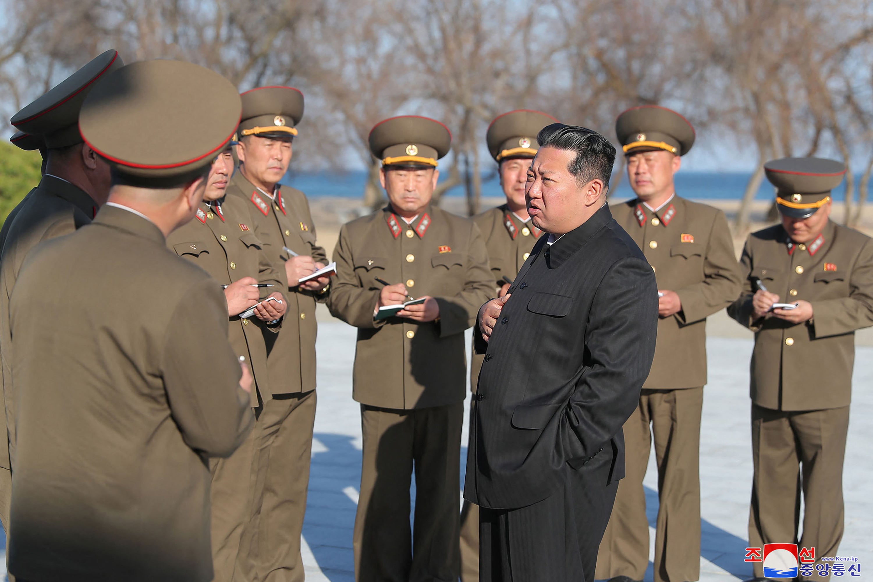 North Korean leader Kim Jong-un observes the test-fire of a new type of tactical guided weapon