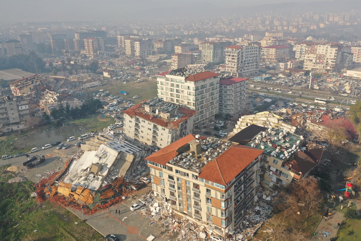 <p>An aerial view shows collapsed and damaged buildings after an earthquake in Hatay, Turkey February 7, 2023.</p>