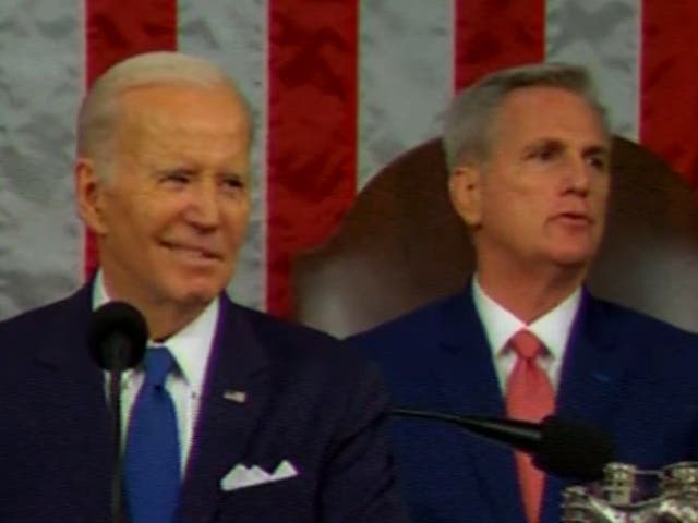 <p>Kevin McCarthy, right, loudly shushes heckling during President Biden’s State of the Union address on 7 February 2023</p>