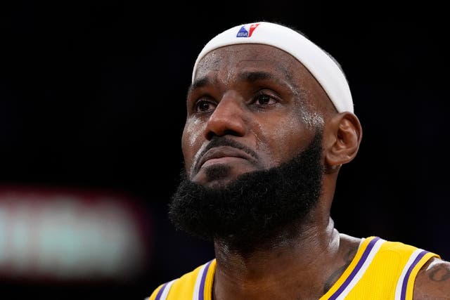 LeBron James tears up after becoming the NBA’s all-time leading scorer (Ashley Landis/AP)