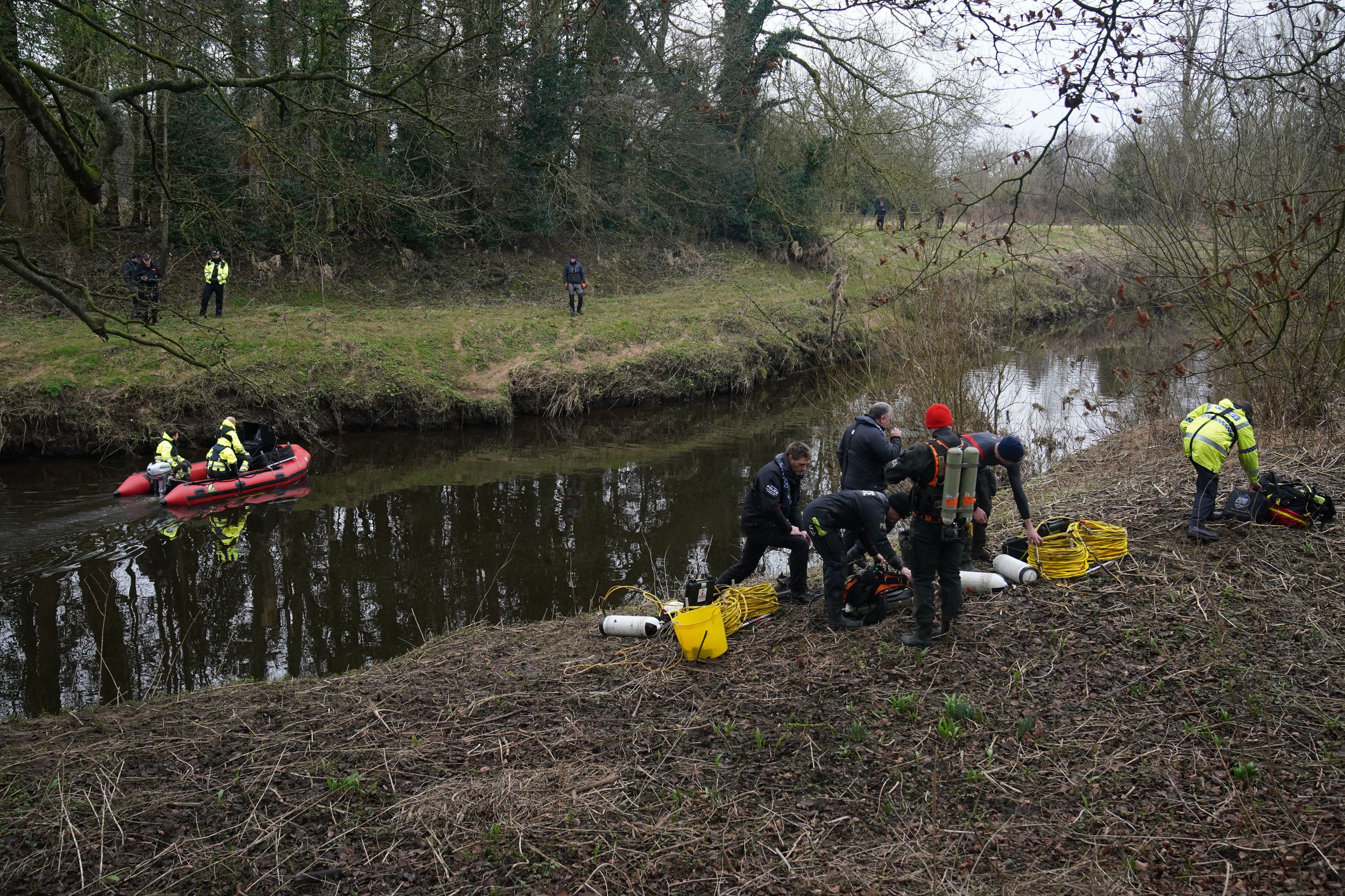 Police search teams at the River Wyre in St Michael’s on Wyre, Lancashire, as they continue their search for missing woman Nicola Bully (Peter Byrne/PA)
