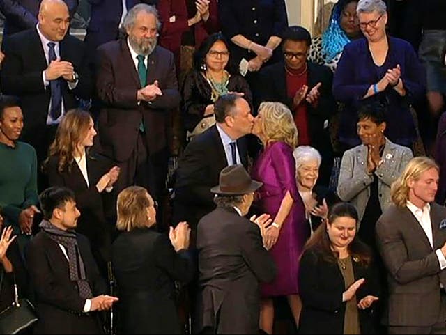 <p>First lady Dr Jill Biden and second gentleman Doug Emhoff share an awkward kiss at the State of the Union</p>