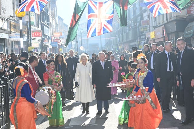 The King and the Queen Consort during a visit to Brick Lane in east London (Eddie Mulholland/The Telegraph/PA)