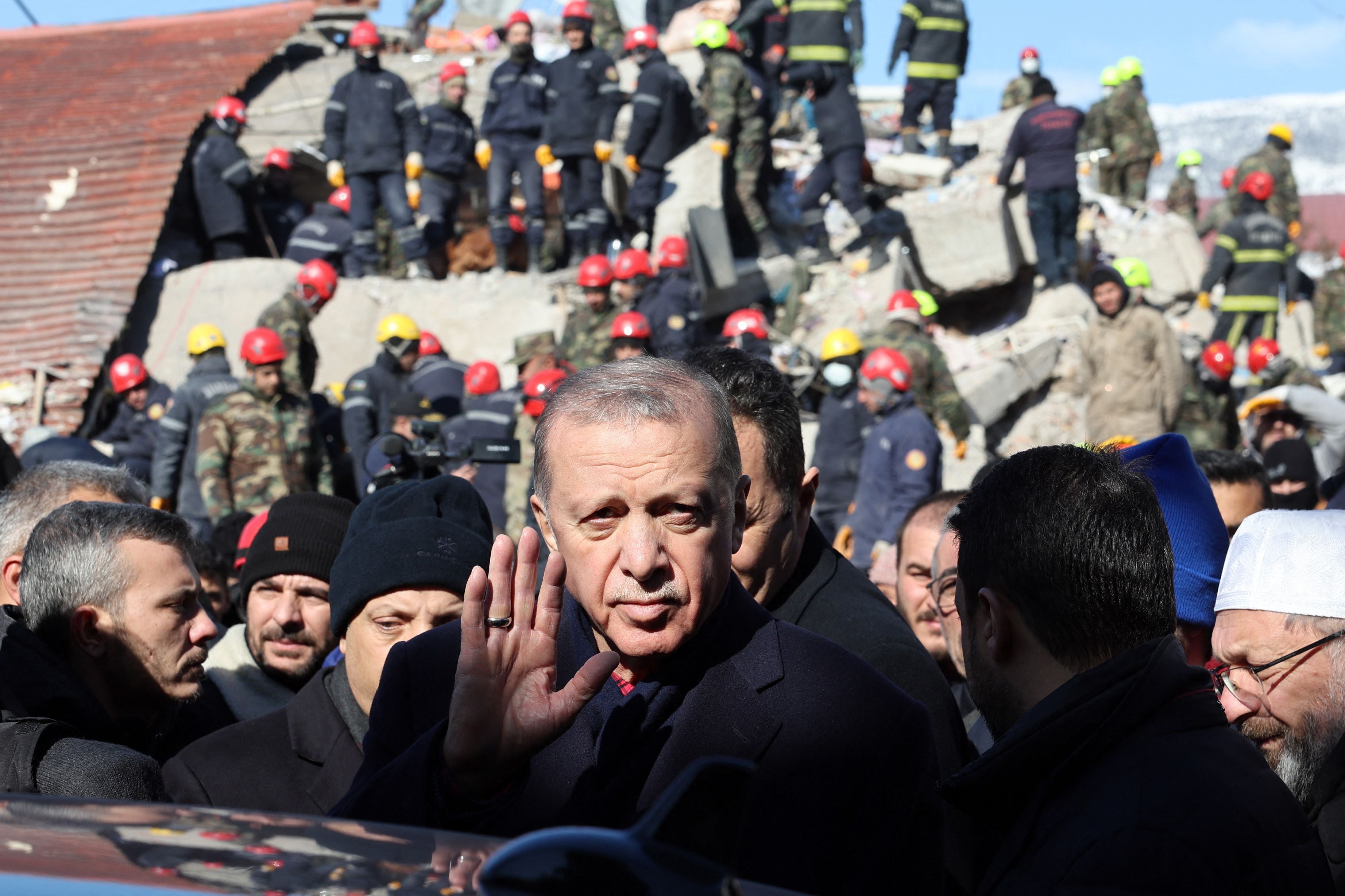 Recep Tayyip Erdogan tours the site of destroyed buildings during his visit to the city of Kahramanmaras in southeast Turkey