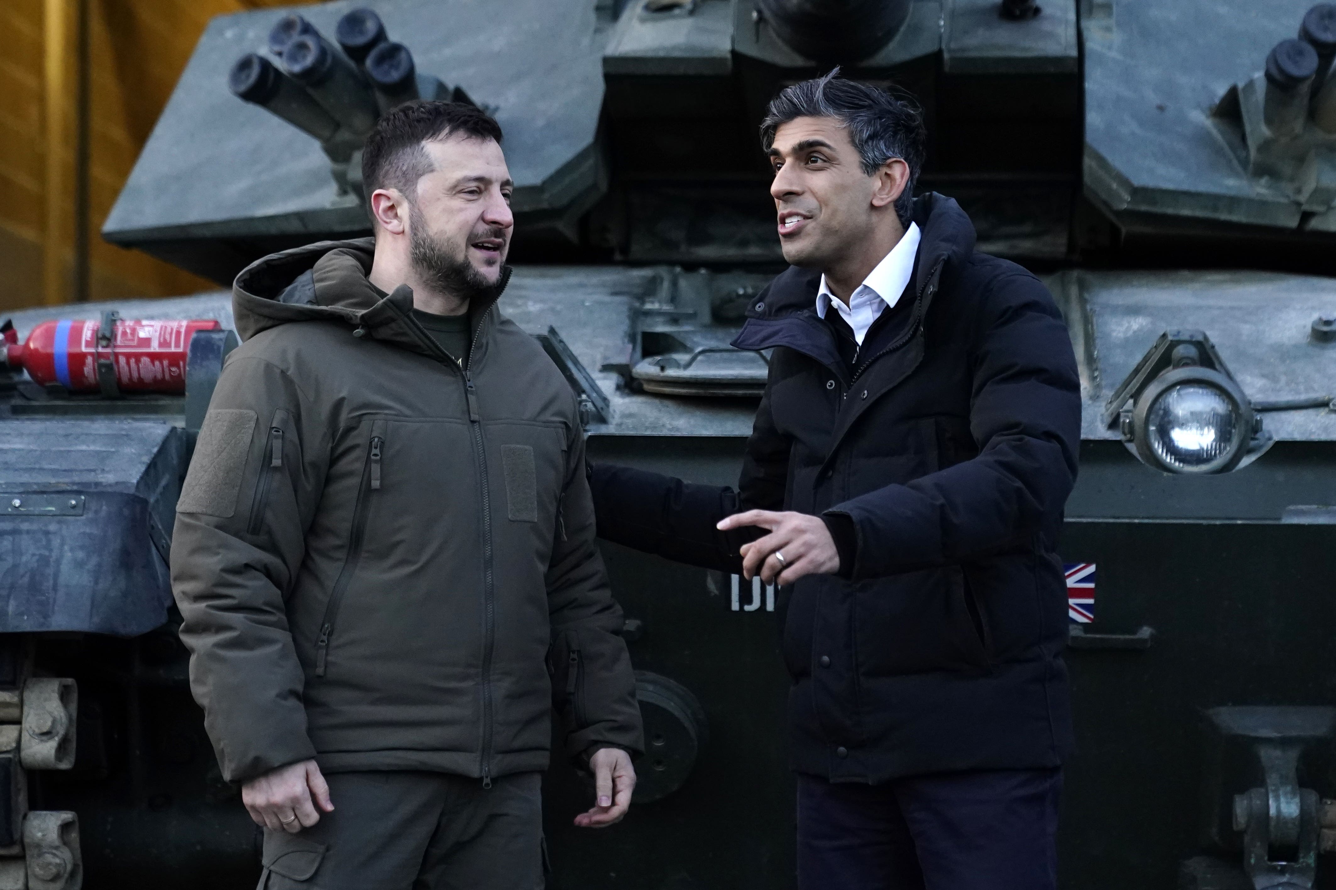 Prime Minister Rishi Sunak and Ukrainian President Volodymyr Zelensky meet Ukrainian troops being trained to command Challenger 2 tanks at a military facility in Lulworth, Dorset (Andrew Matthews/PA)