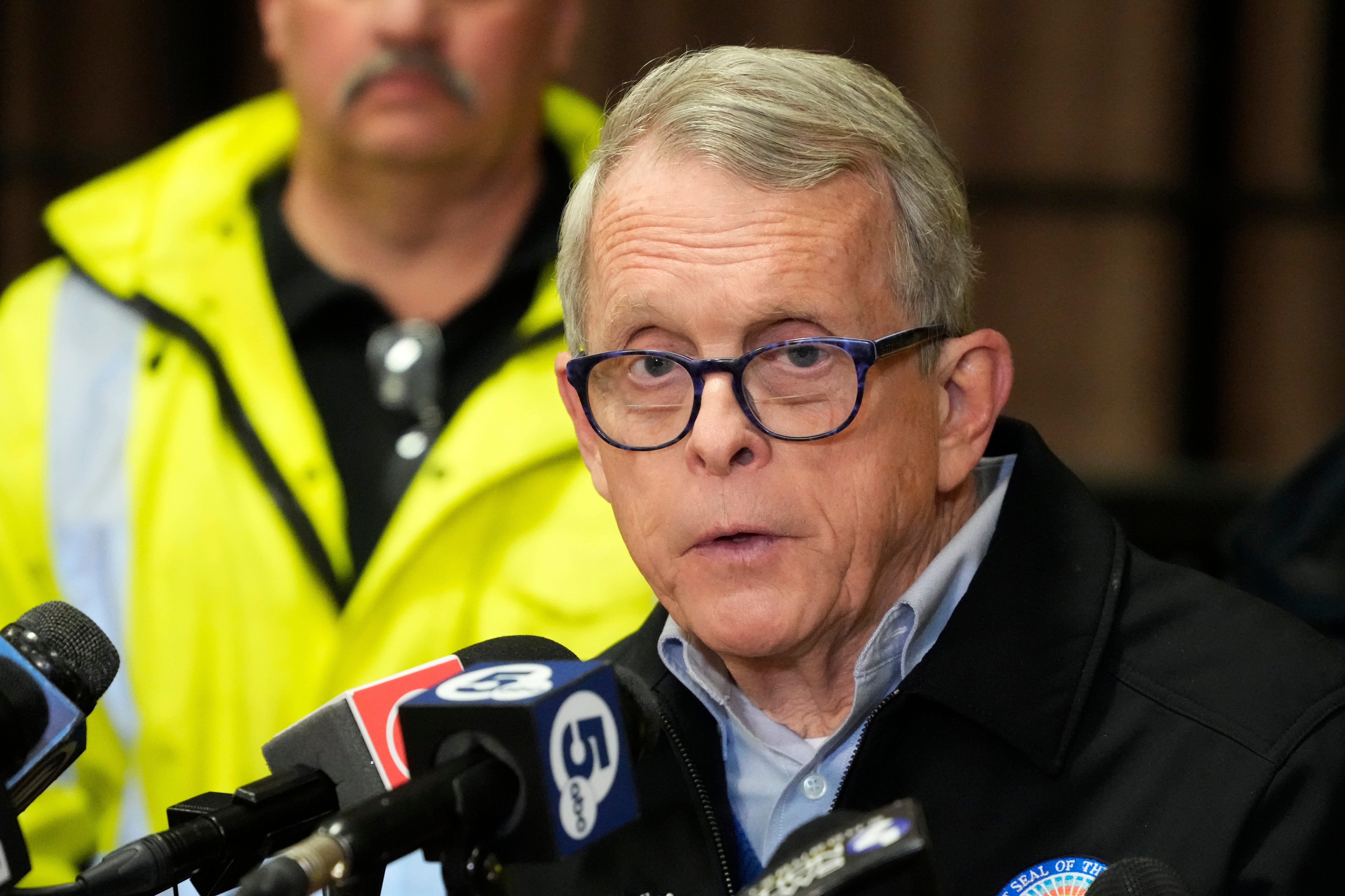 Ohio Gov. Mike DeWine meets with reporters after touring the Norfolk Southern train derailment site in East Palestine, Ohio, Monday, Feb. 6, 2023