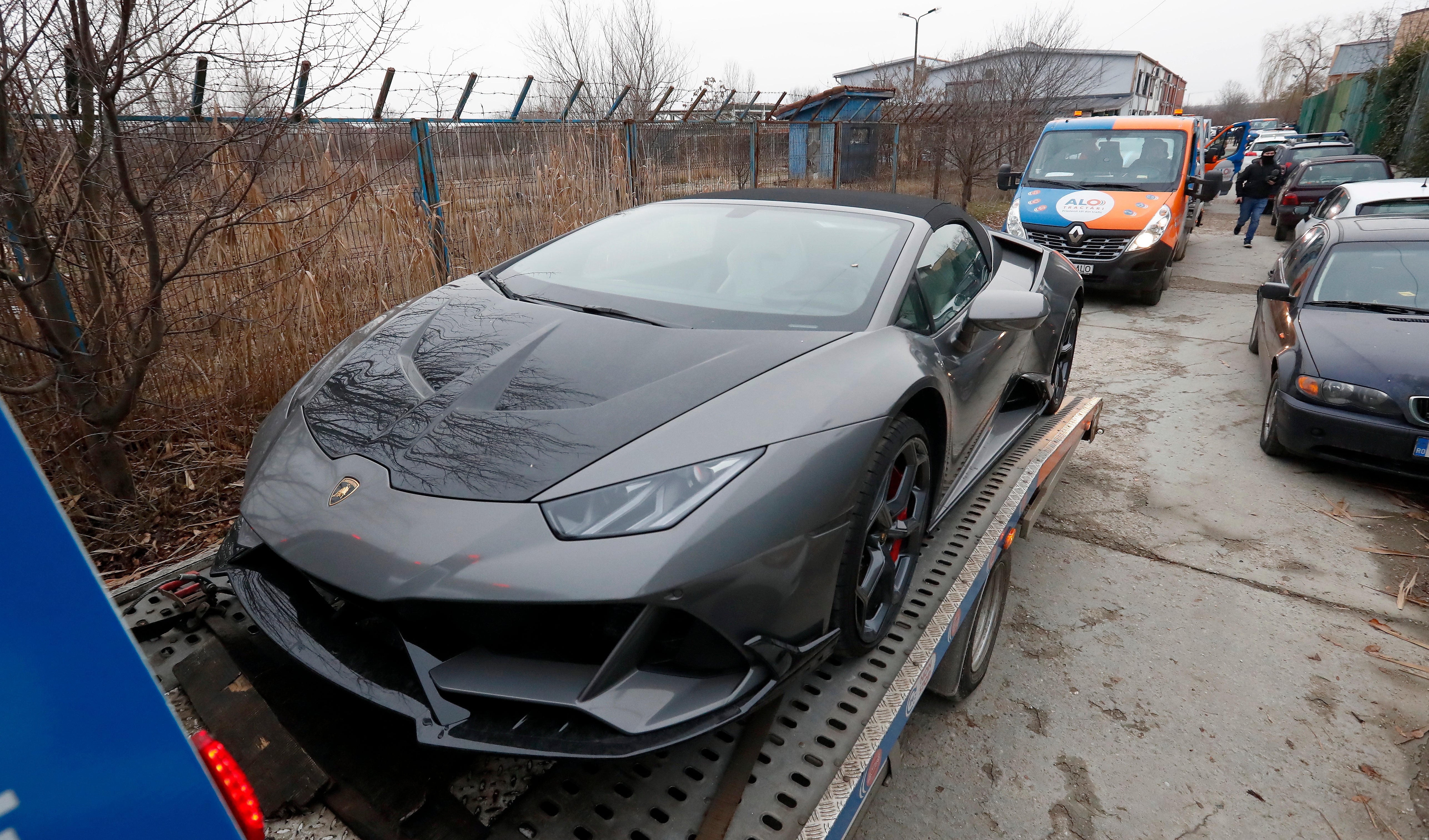 A Lamborghini belonging to Tate is towed away in Bucharest